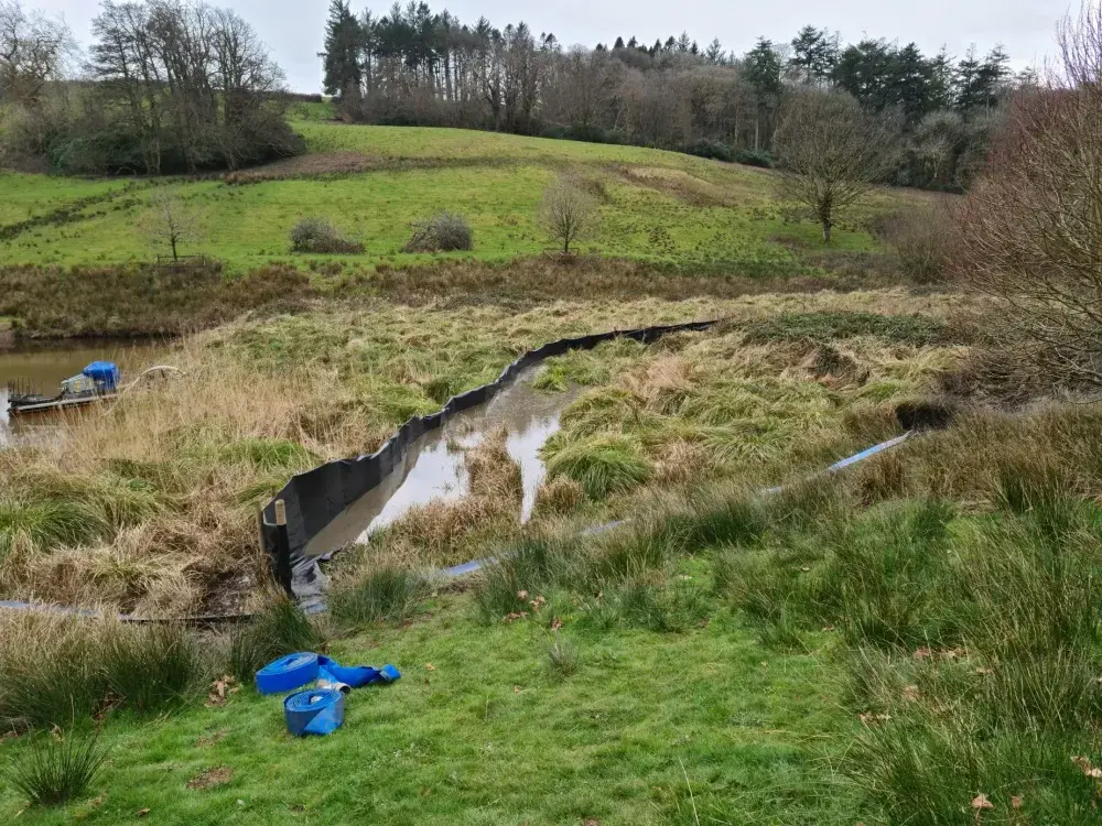 Temporary semi-permeable membrane used to contain silt during winter pumping works