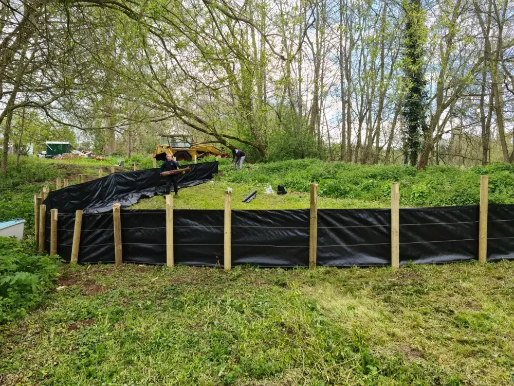 Silt contained within temporary membranes during drying following pumping works