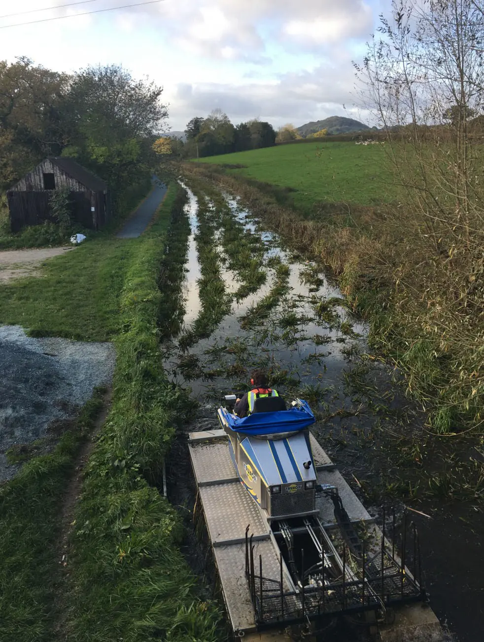 Before carrying out aquatic weed cutting and reed management on a Welsh canal