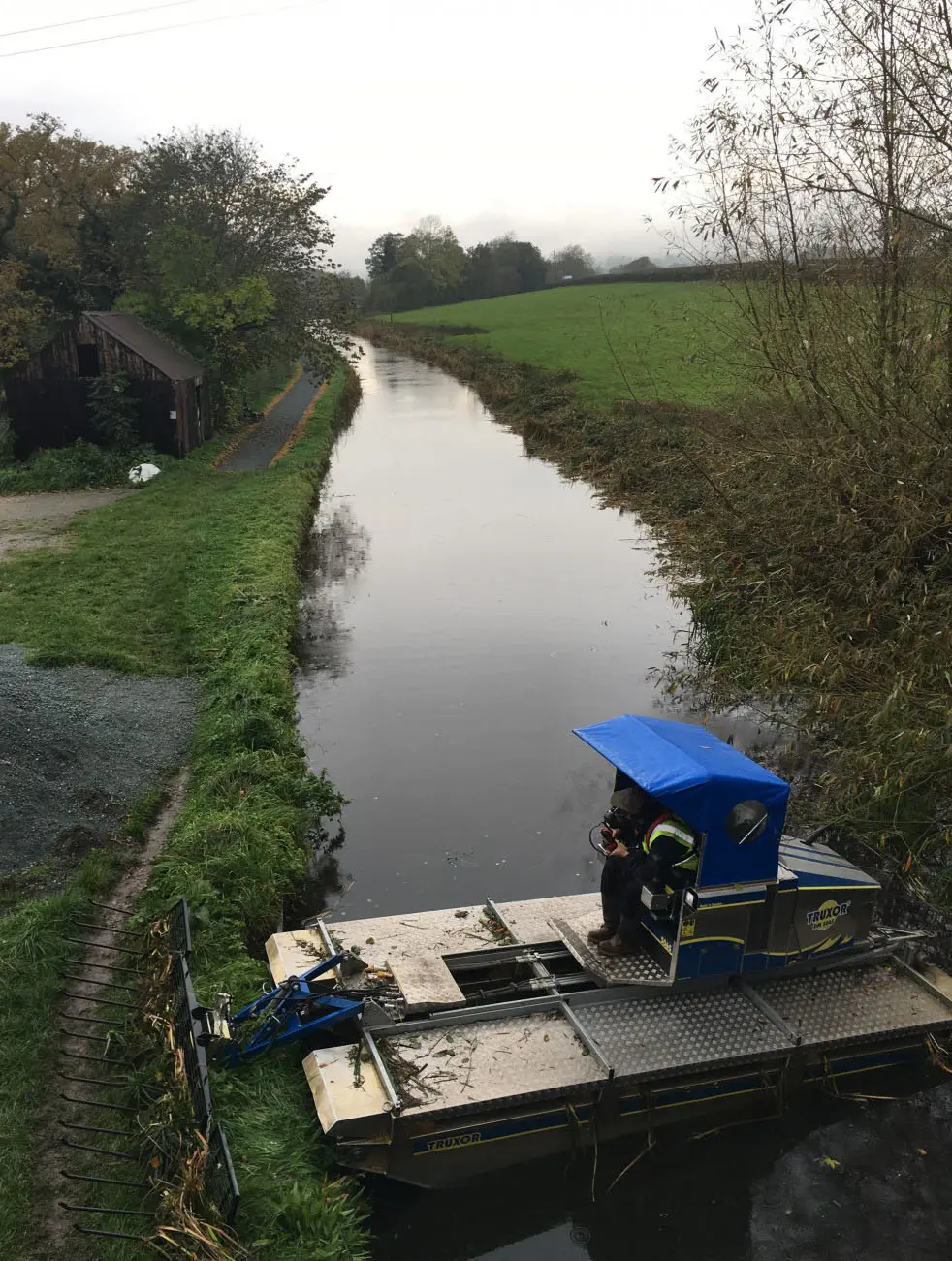 After carrying out aquatic weed cutting and reed management on a Welsh canal